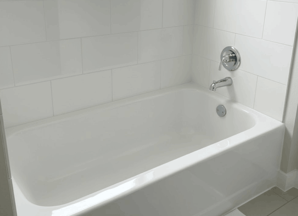 freshly refinished bathtubs in apartment units, all uniform and glossy.